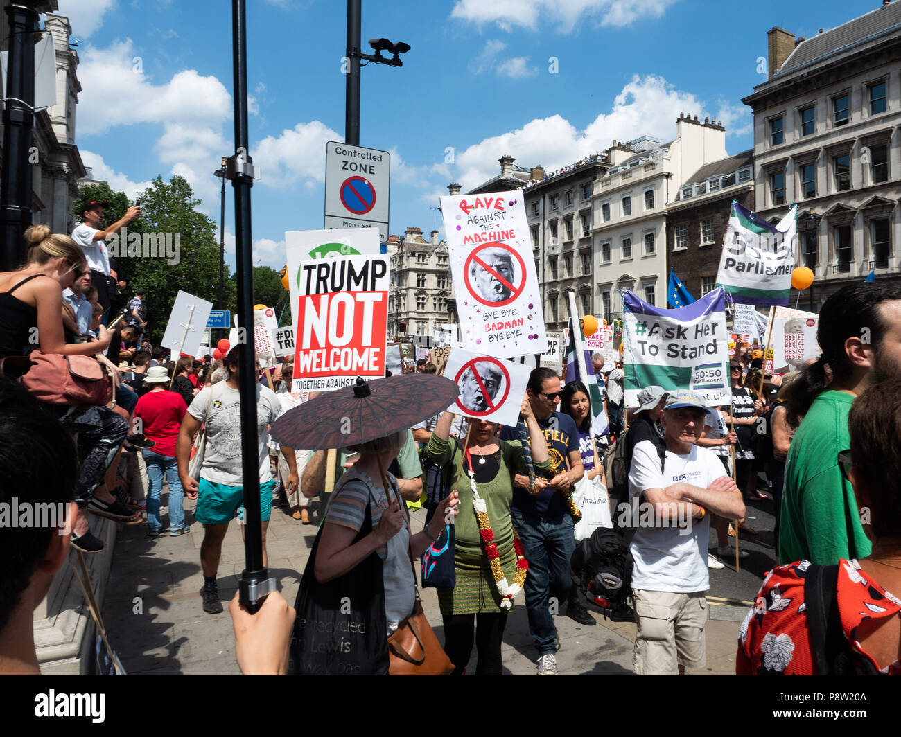 London, UK. 13th July 2018. Thousands of protesters are peacefully marching through central London with their anti-trump placards, banners and flags in protest of Donald Trump's visit.Credit: Ghene Snowdon/Alamy Live News Stock Photo