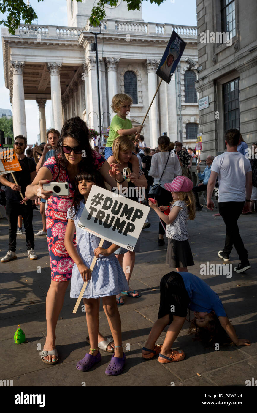 London, UK: Protesters against the visit of US President Donald Trump to the UK, gather in Trafalgar Square after marching through central London, on 13th July 2018, in London, England.  Photo by Richard Baker / Alamy Live News Stock Photo