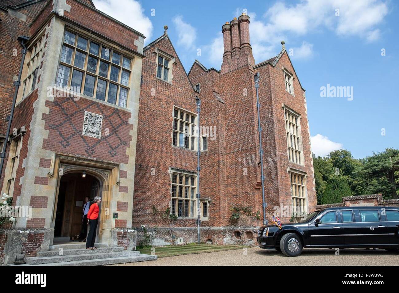 London, UK, 13 July 2018. British Prime Minister Theresa May waits for the limousine carrying U.S President Donald Trump to arrive for bilateral talks at Chequers July 12, 2018 in Buckinghamshire, England. Chequers is the country residence of the Prime Minister. Credit: Planetpix/Alamy Live News Stock Photo