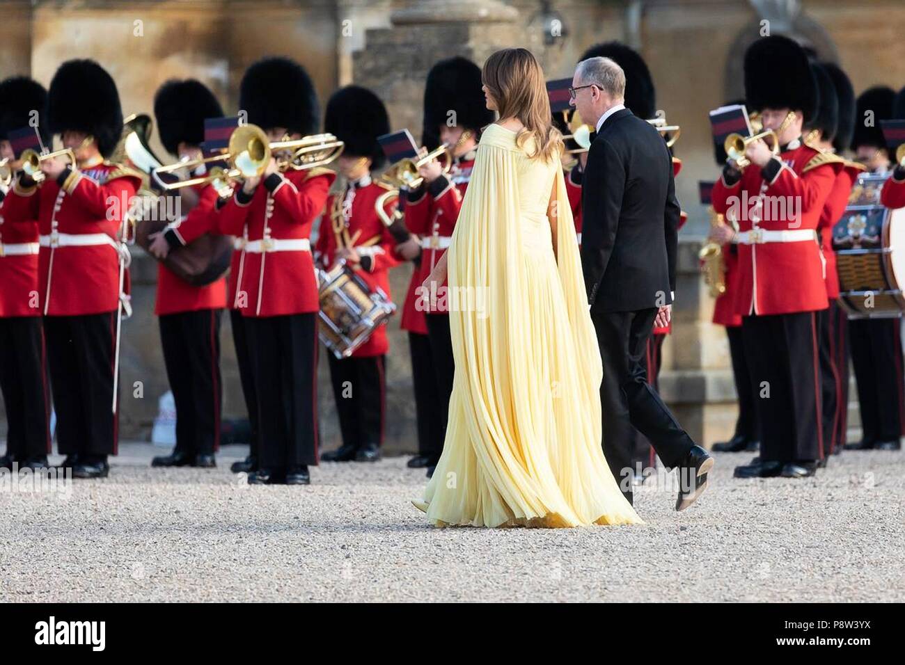 London, UK, 13 July 2018. U.S First Lady Melania Trump is escorted by Philip May, husband of British Prime Minister Theresa May during the arrival for dinner at Blenheim Palace July 12, 2018 in Oxfordshire, England. Credit: Planetpix/Alamy Live News Stock Photo
