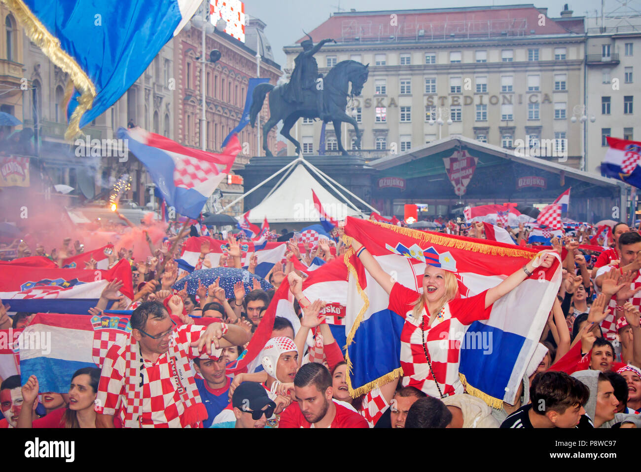 ZAGREB, CROATIA - JULY 11 Croatian football fans on the Ban Jelacic Square, watching 2018 FIFA WORLD CUP RUSSIA match Croatia vs England on July 11, 2 Stock Photo