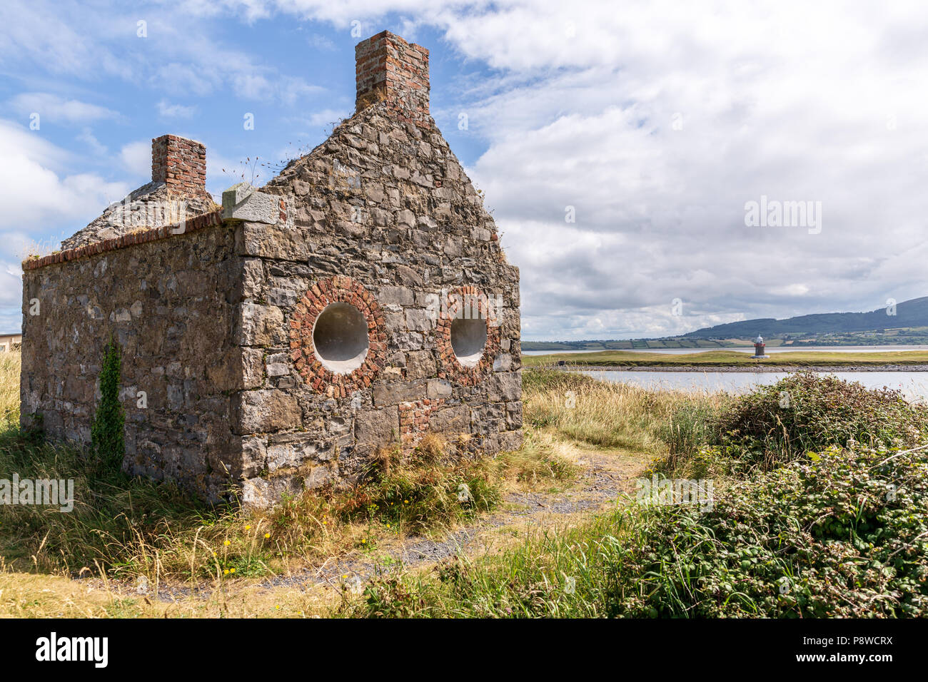 In ruins the Old Watchhouse with circle windows at the Rosses Point used by Sligo River Pilots to watch for sailing ships. Stock Photo