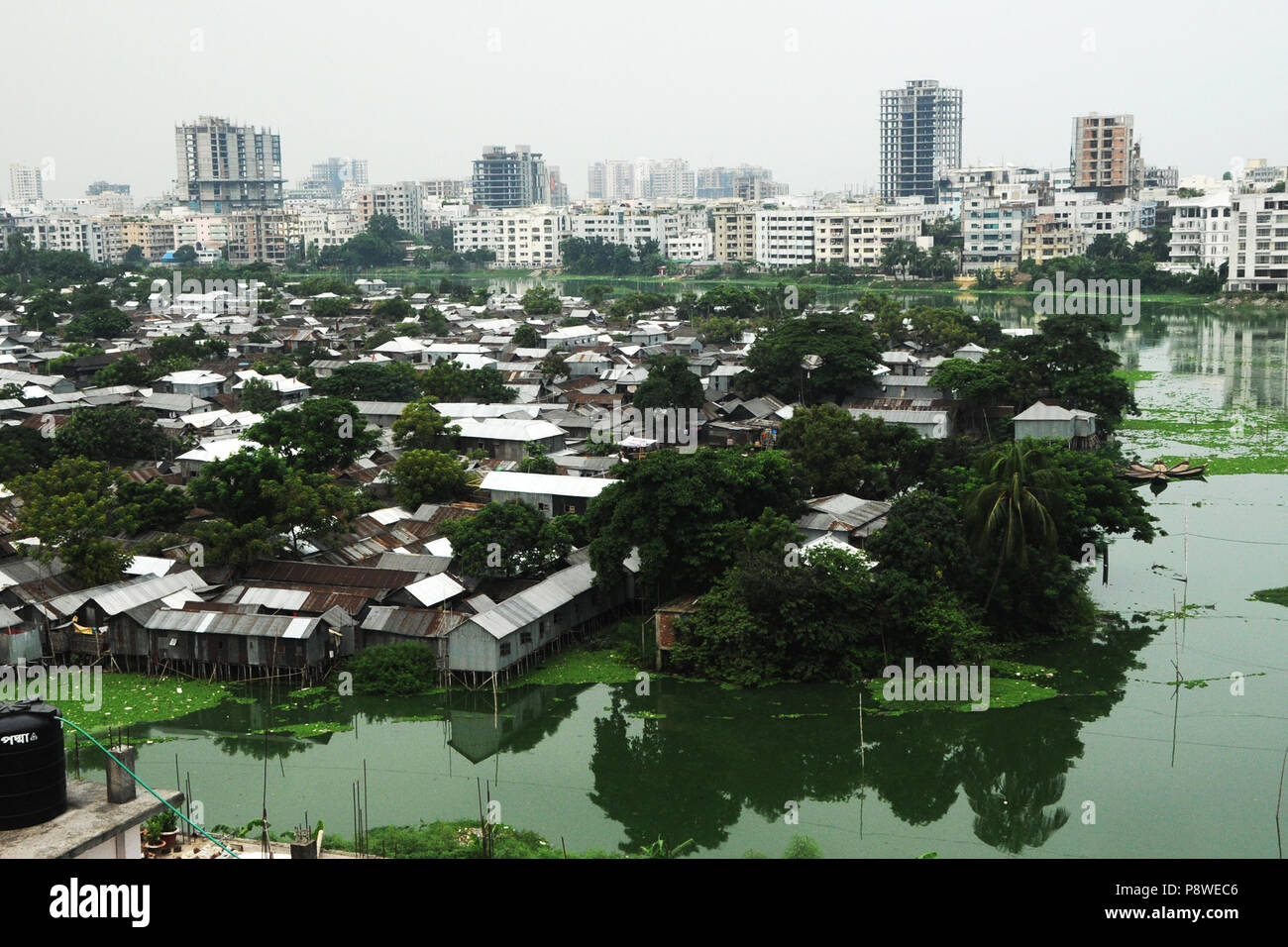 A top view of Korail Slum is located beside the Gulshan-Banani Lake in Dhaka North City Corporation. About 40,000 people lived in Korail, the biggest  Stock Photo