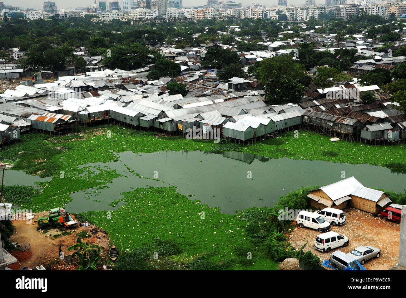 A top view of Korail Slum is located beside the Gulshan-Banani Lake in Dhaka North City Corporation. About 40,000 people lived in Korail, the biggest  Stock Photo