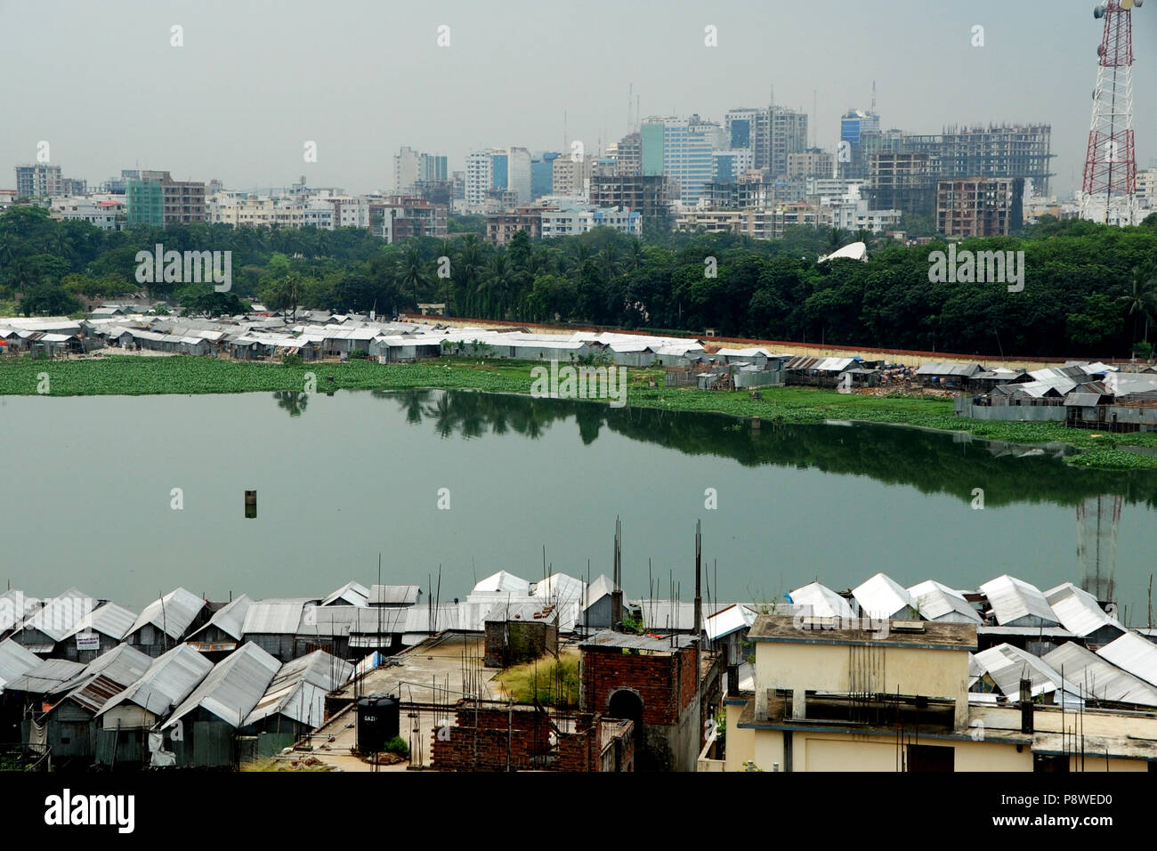 A top view of Korail Slum is located beside the Gulshan-Banani Lake in Dhaka North City Corporation. About 40,000 people lived in Korail, the biggest  Stock Photo