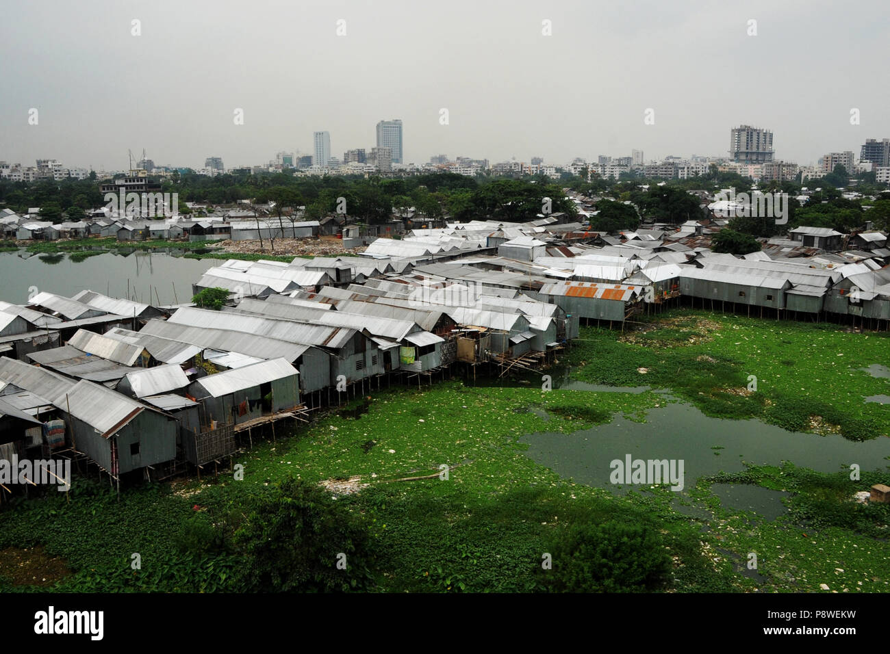 A top view of Korail Slum is located beside the Gulshan-Banani Lake in Dhaka North City Corporation. About 40,000 people lived in Korail, the biggest  Stock Photo