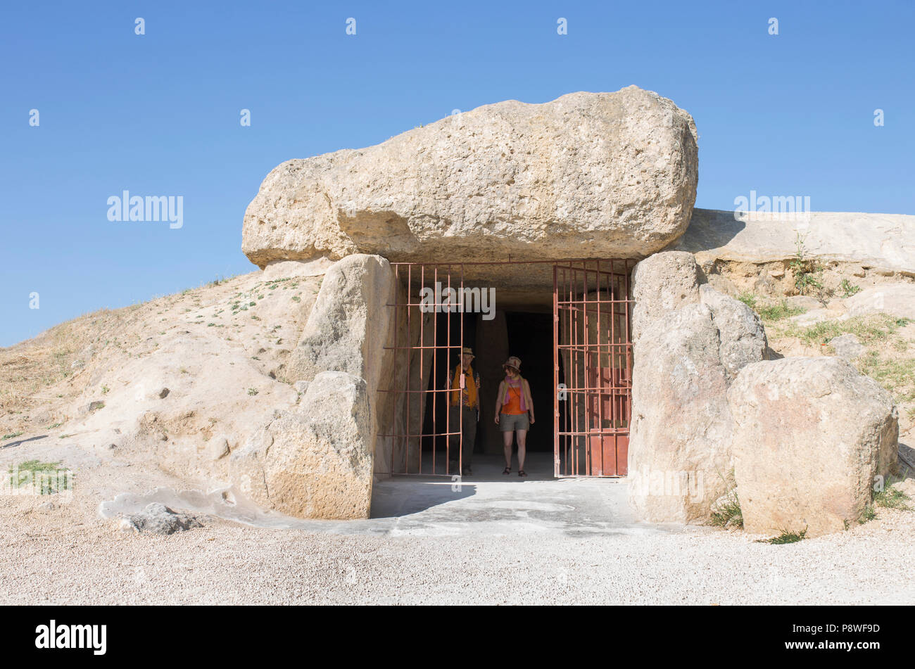 Antequera ,Spain - July 10, 2018: Visitors at entrance to Dolmen of Menga in Antequera. Dating from the 3rd millennium BCE Stock Photo