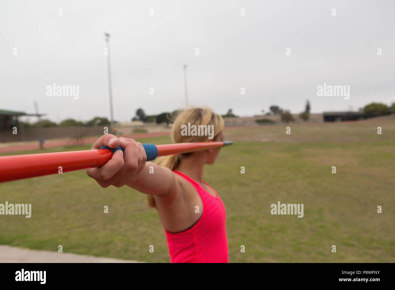 Female athlete practicing javelin throw Stock Photo