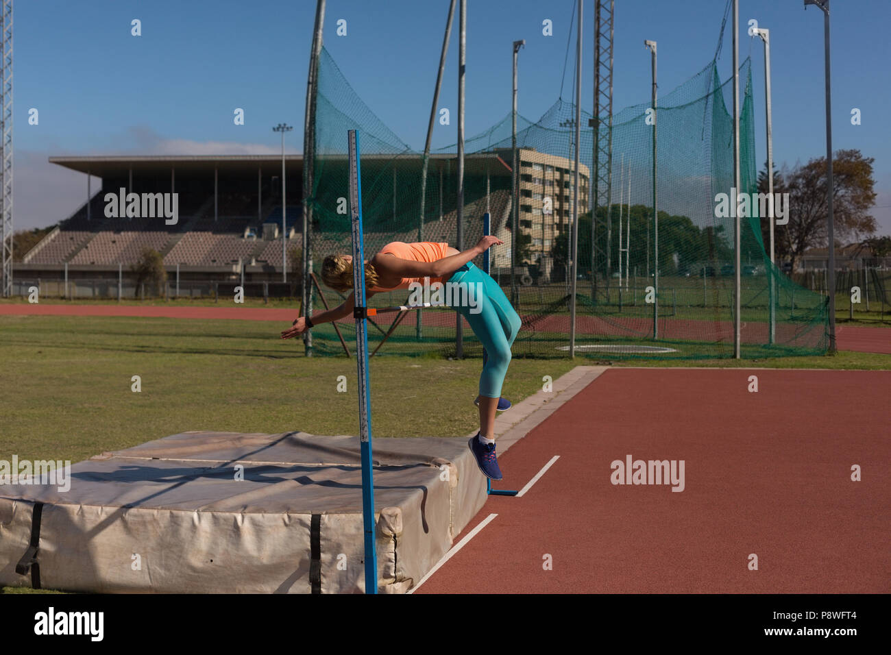 Female athlete practicing high jump Stock Photo Alamy