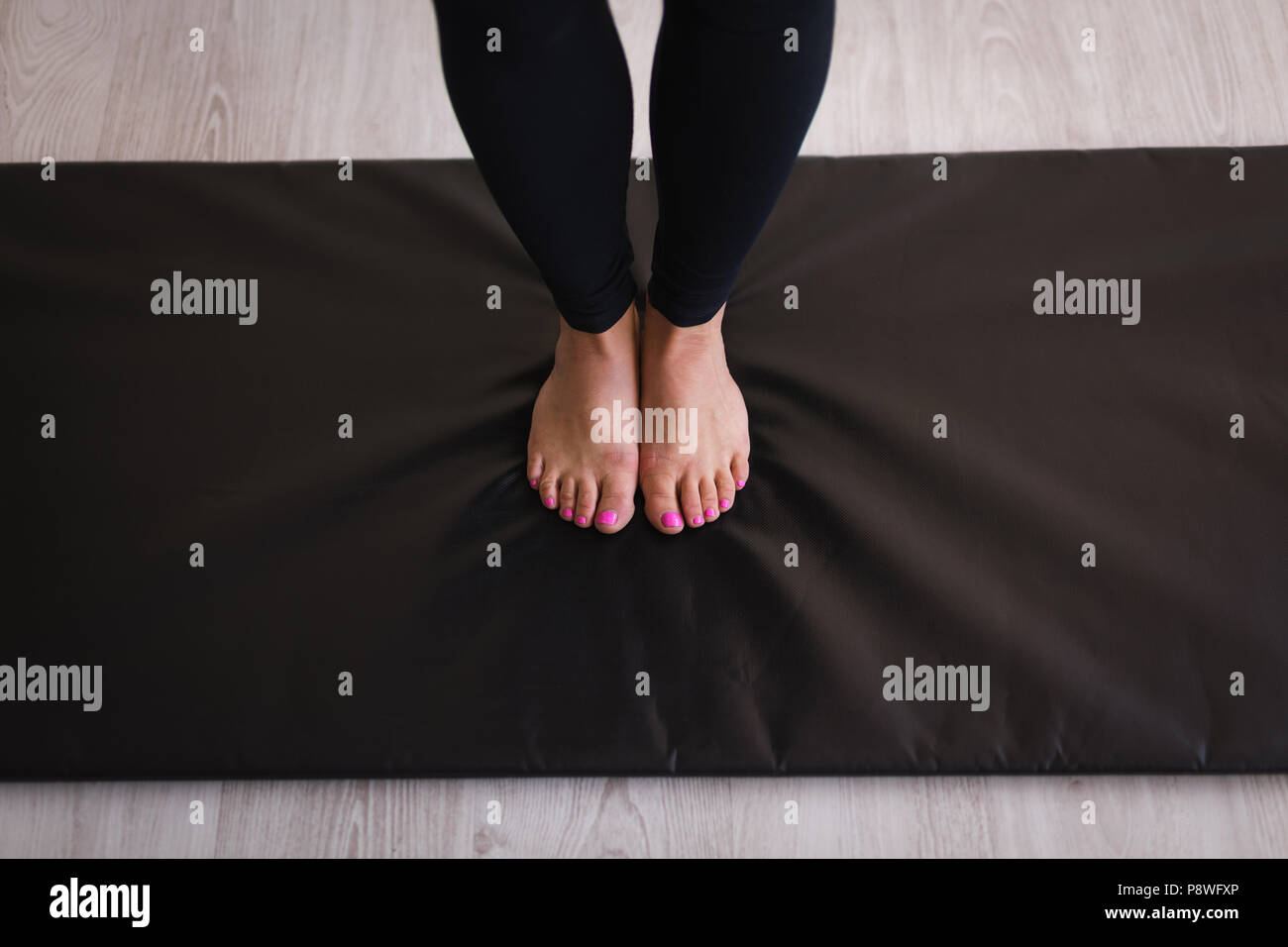 Woman performing stretching exercise Stock Photo
