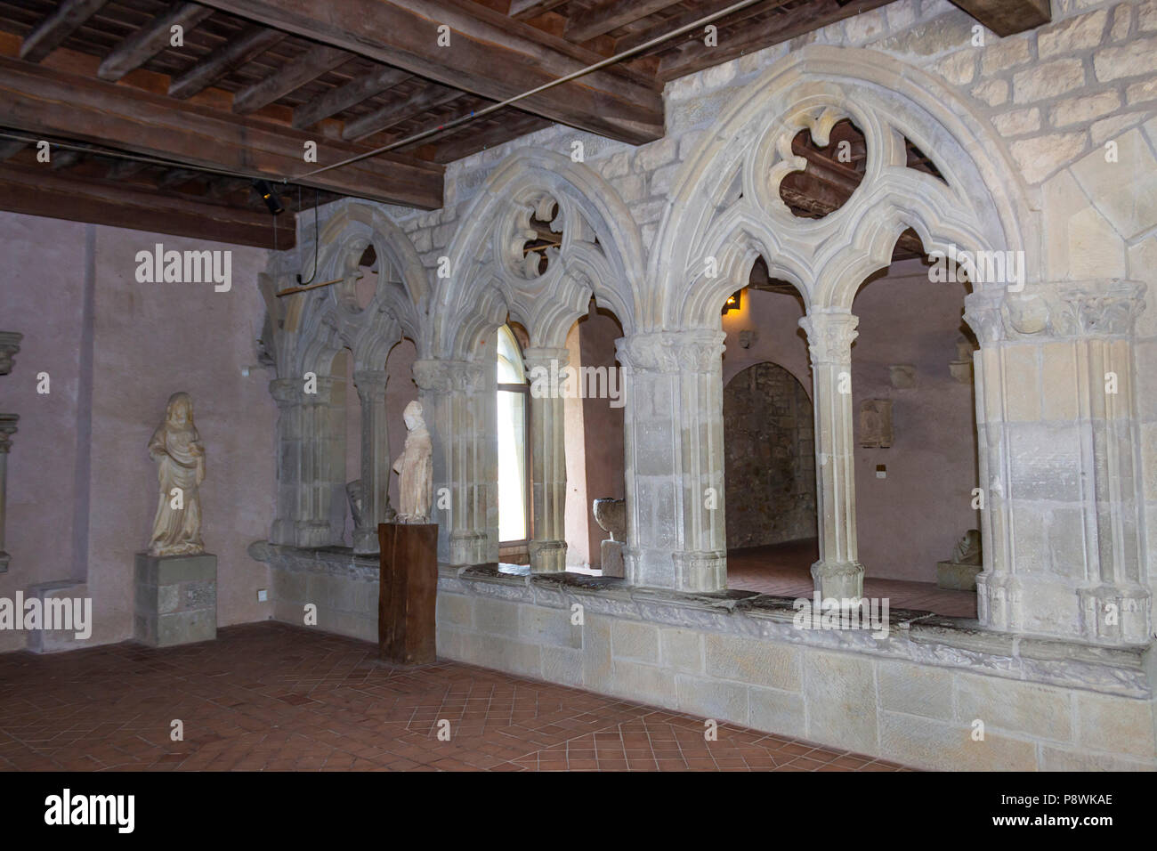 The medieval Cité of Carcassonne, French department of Aude, Occitanie Region, France.  The Salle des arcades inside La Chateau Comtal,  the windows t Stock Photo