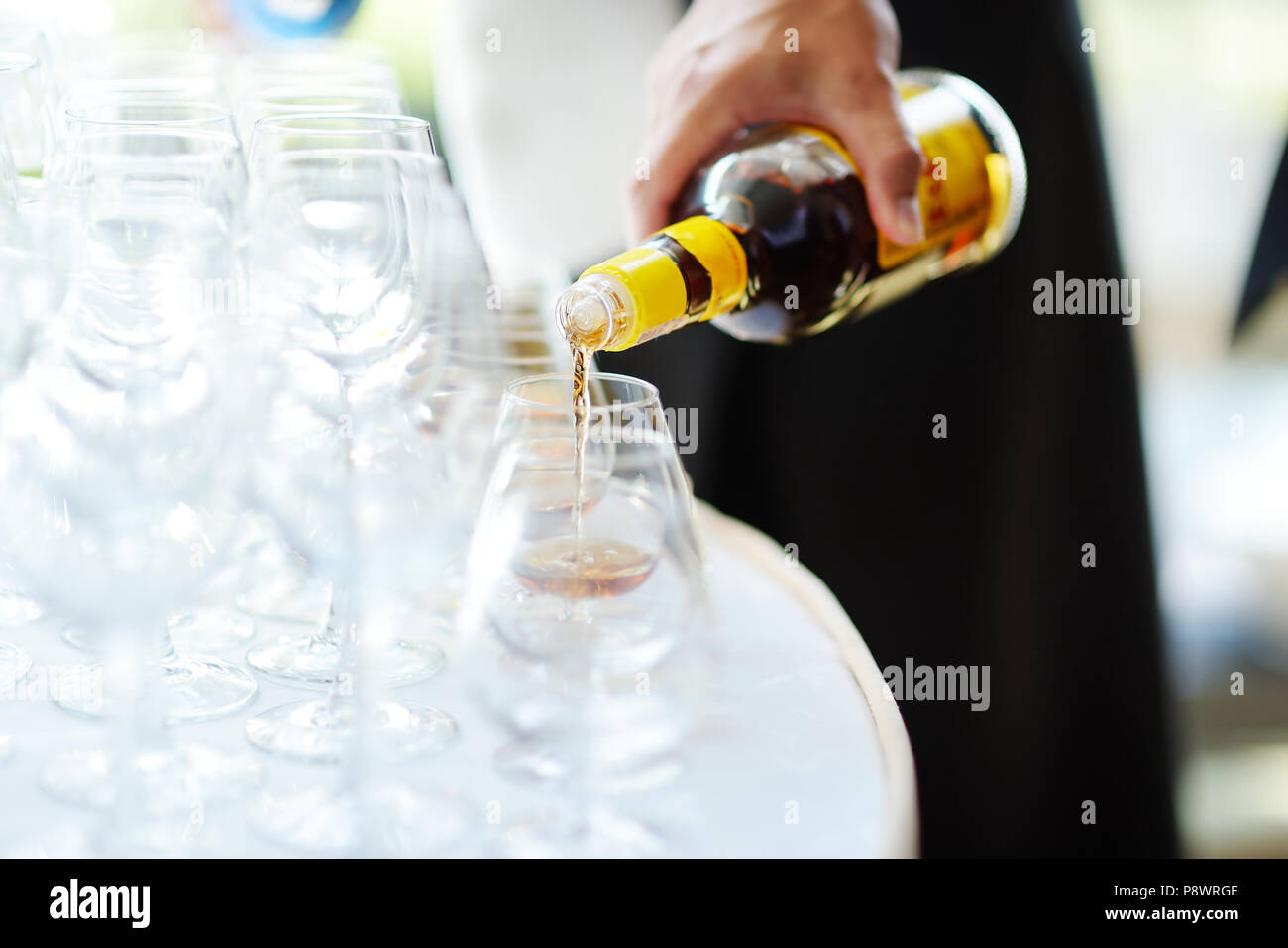 Pouring Alcohol Into A Glasses On A Festive Event Party Or