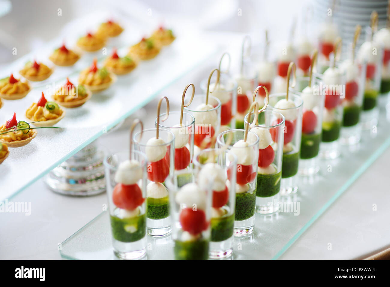 Plates with assorted finger food snacks on an event party or dinner Stock Photo