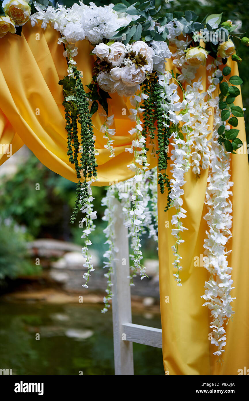 Arch For Wedding Ceremony In The Open Air Decorated With Yellow