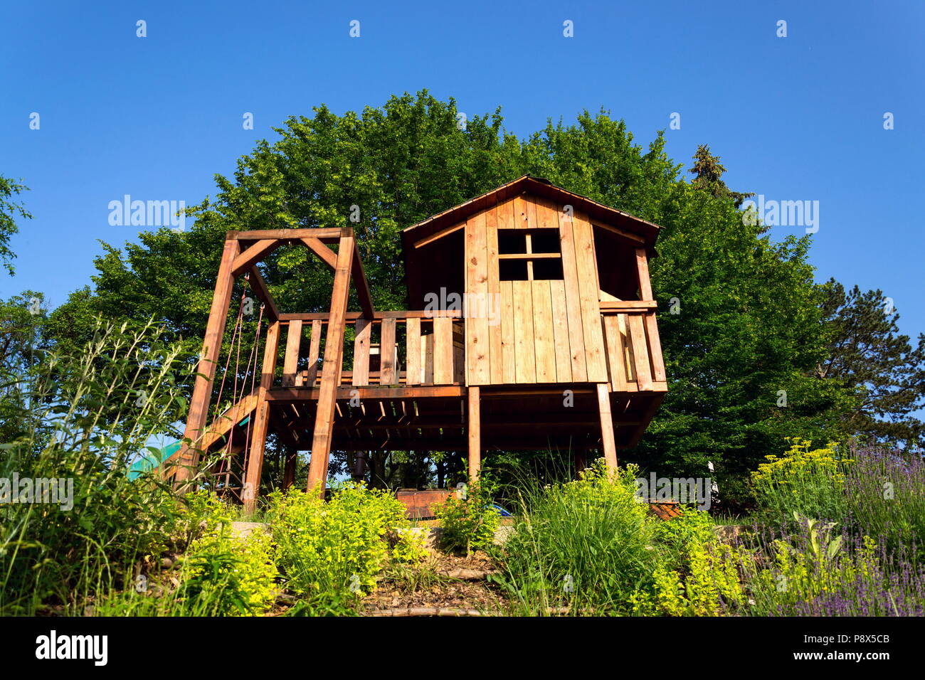 childrens playhouse with slide and swing