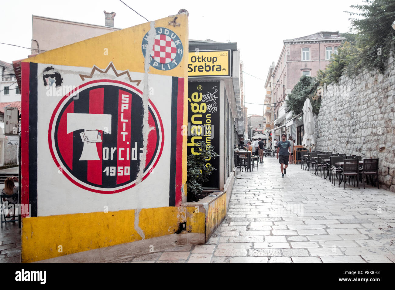 Wall painted with logos of soccer club Hajduk Split and fan club Torcida. Split, Croatia. Stock Photo