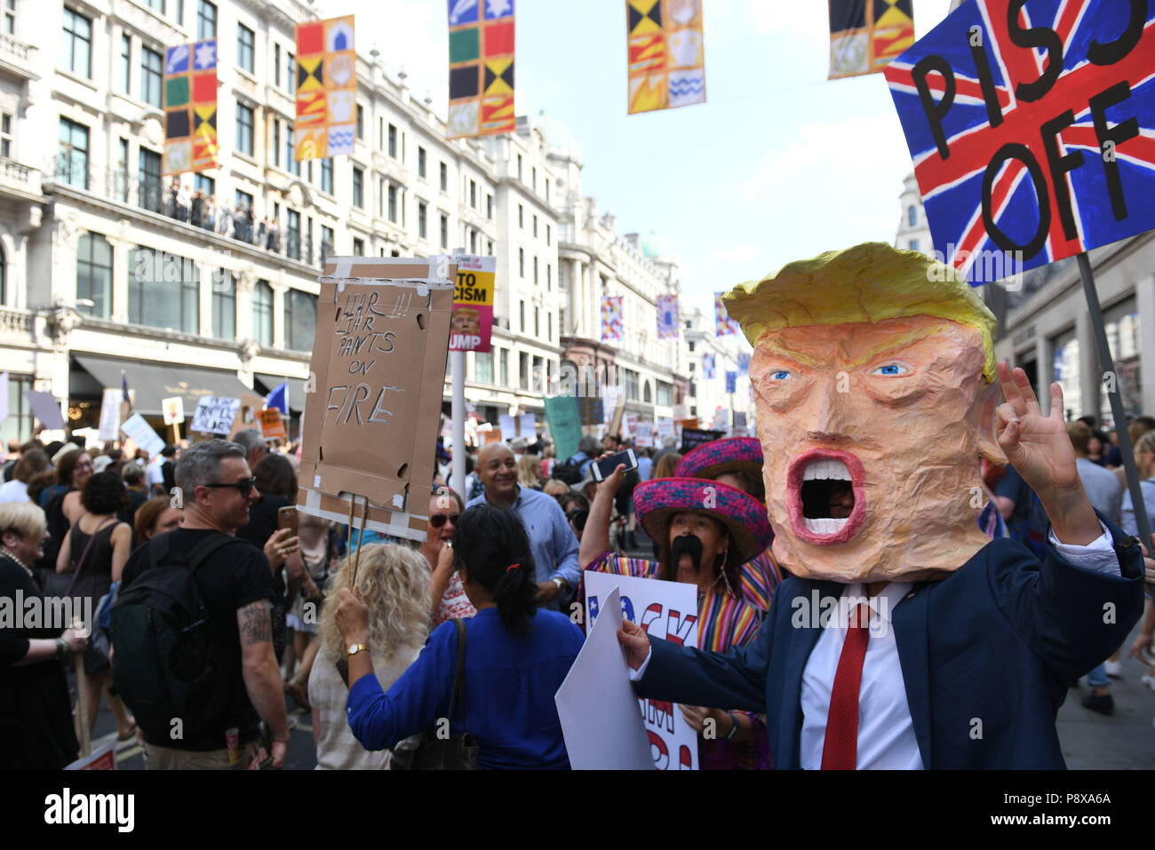 Demonstrators on a 'Stop Trump' march through London, as part of the protests against the visit of US President Donald Trump to the UK. Stock Photo