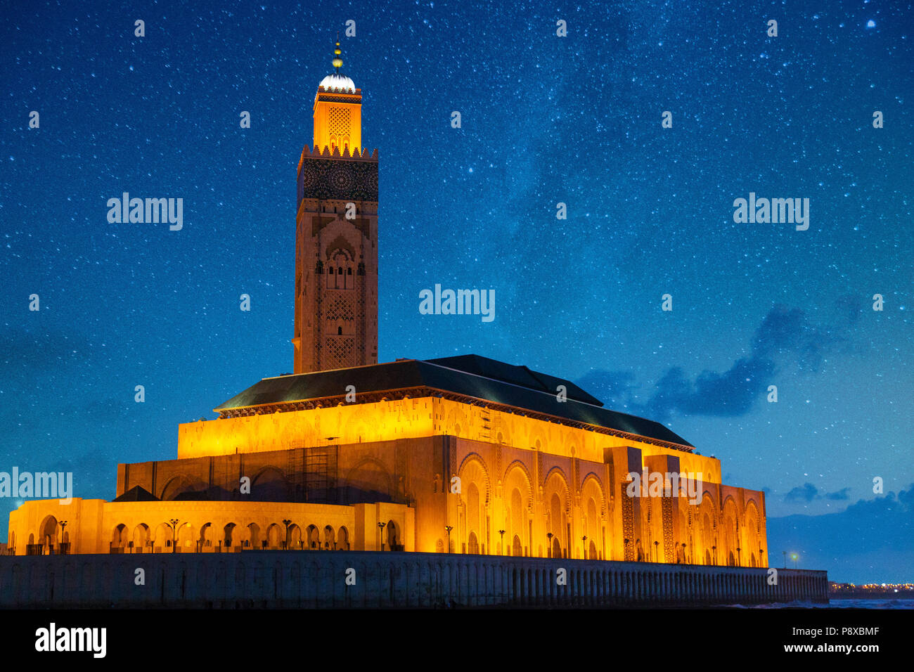 view of Hassan II mosque against a sky full of stars - Casablanca - Morocco Stock Photo