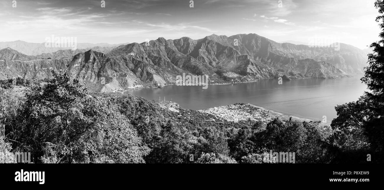 Panorama of Lake Atitlan with it's volcanic highlands in black and white Stock Photo