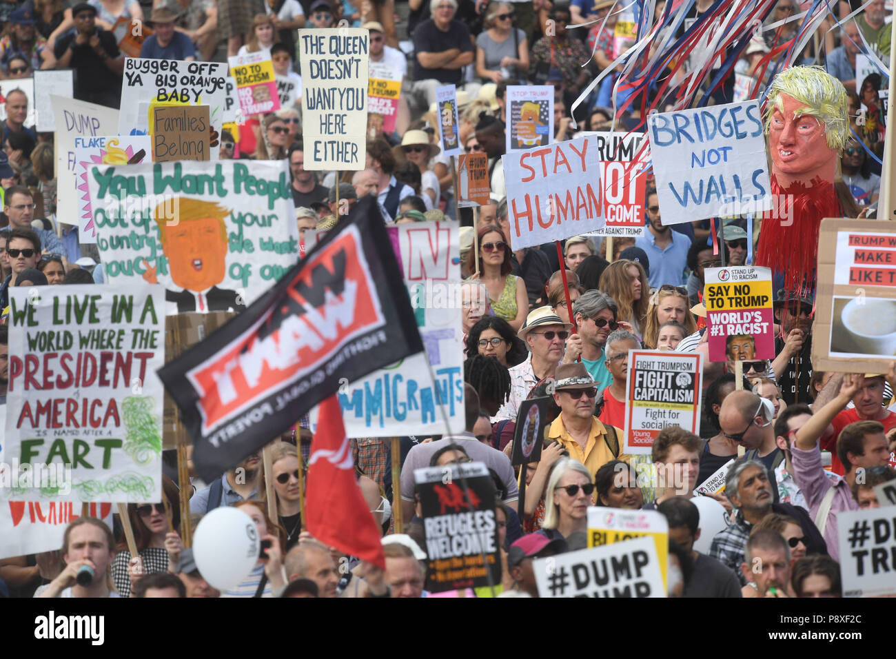 'Stop Trump' demonstrators gather in Trafalgar Square after marching through London as part of the protests against the visit of US President Donald Trump to the UK. Stock Photo