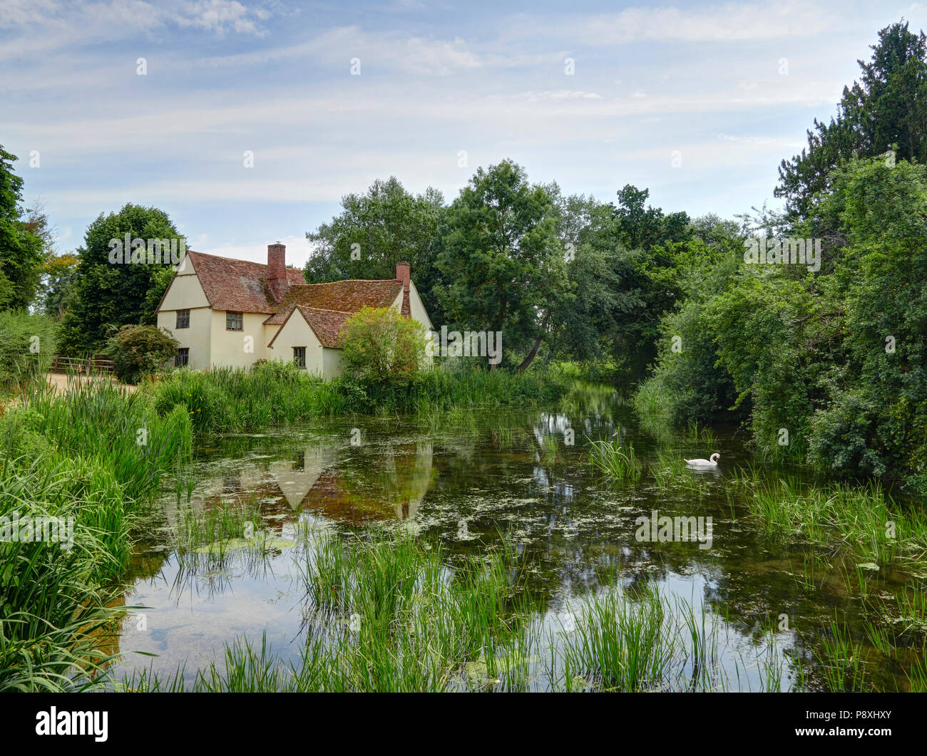 Flatford mill Willy Lotts cottage on the river Stour East Bergholt in the Dedham Vale made famouse by the artist John Constable Stock Photo