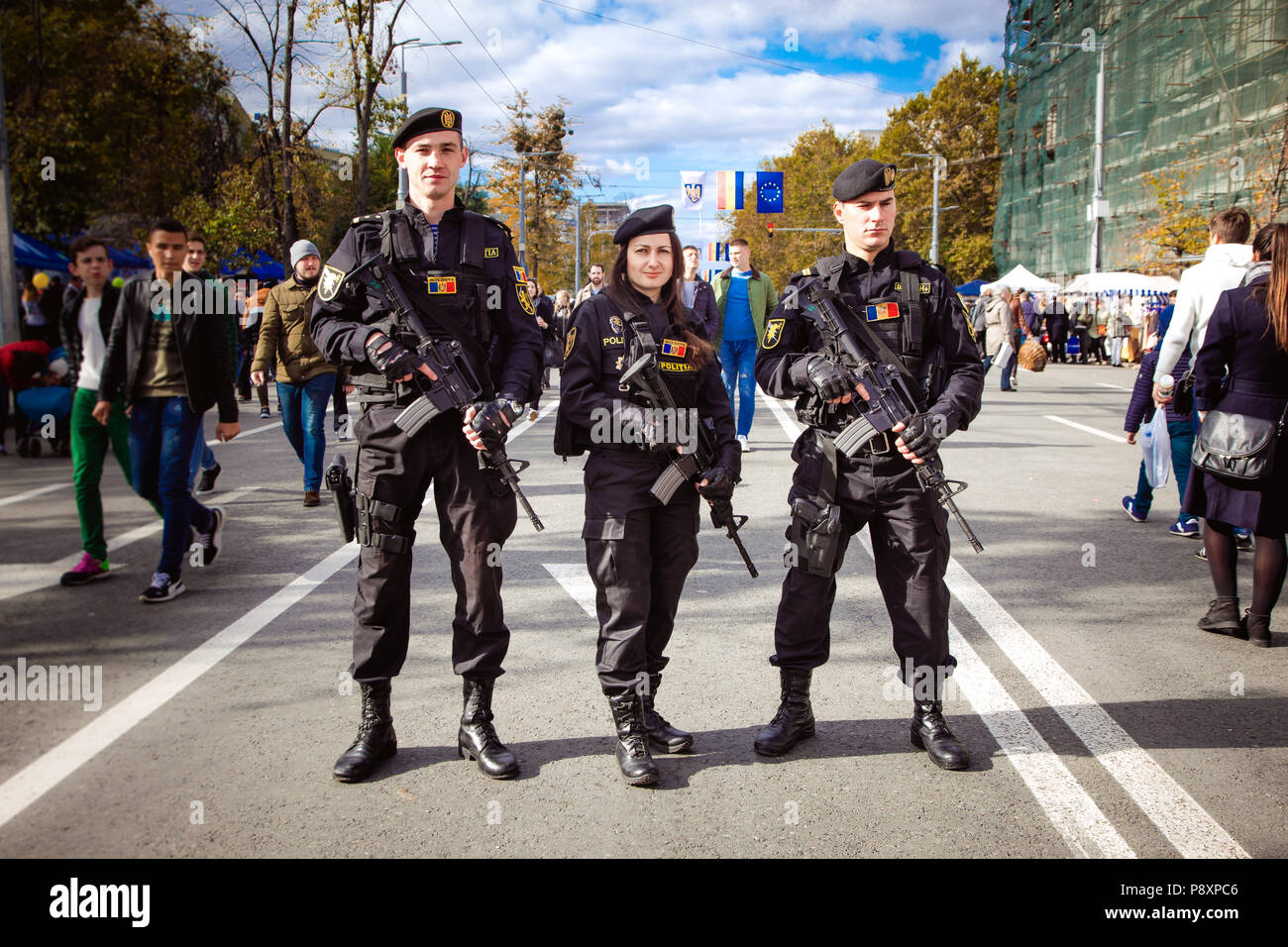14 octomber 2017 three policemen with automatic rifles posing on holiday, Chisinau, Moldova Stock Photo