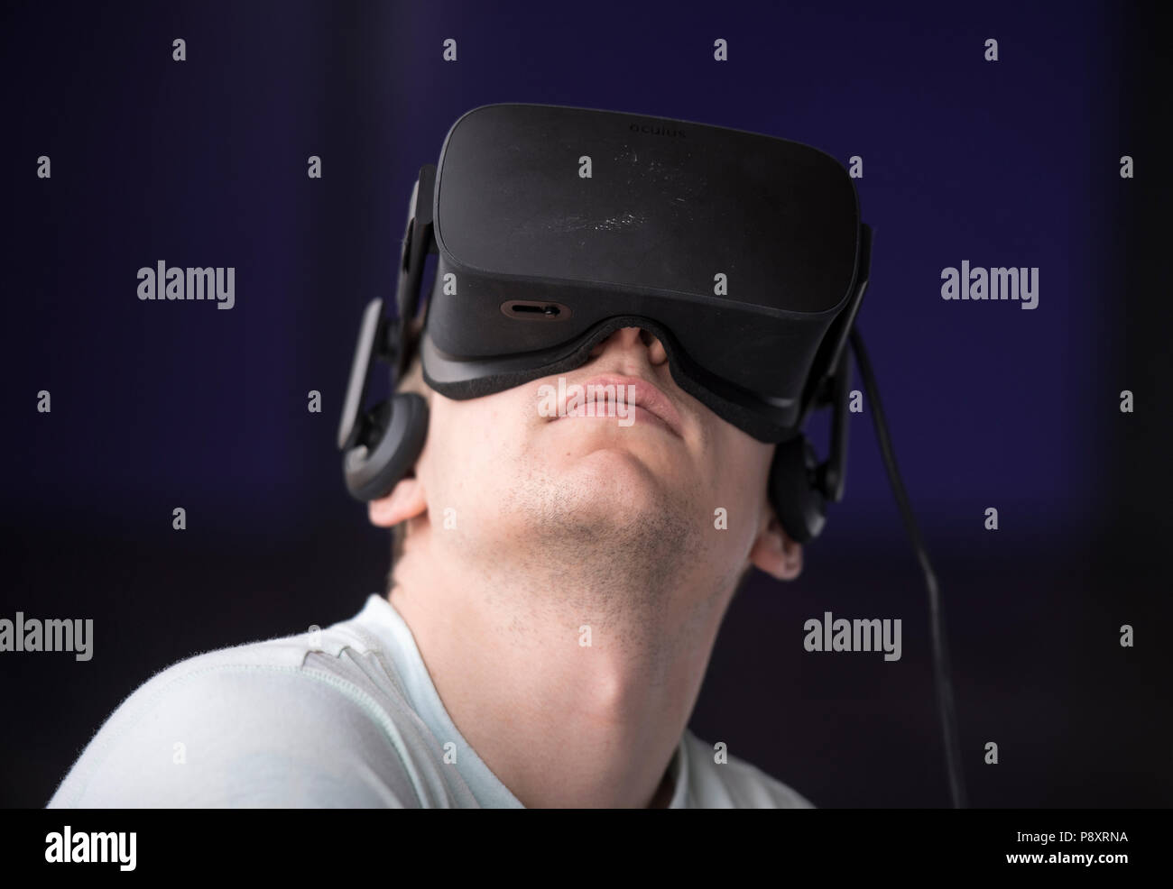 Young man using a virtual reality headset Stock Photo