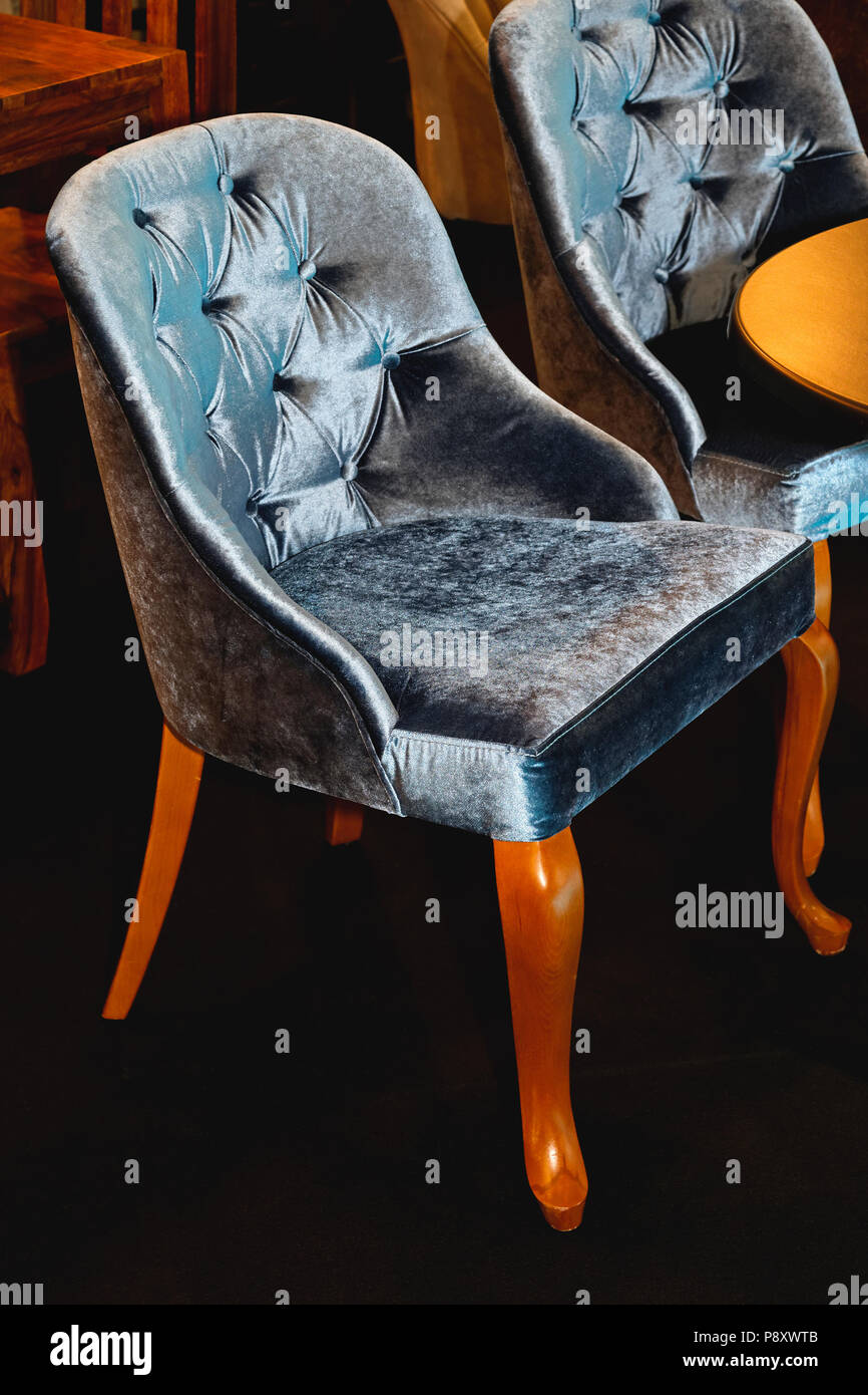 Blue velvet chair classic style furniture Stock Photo