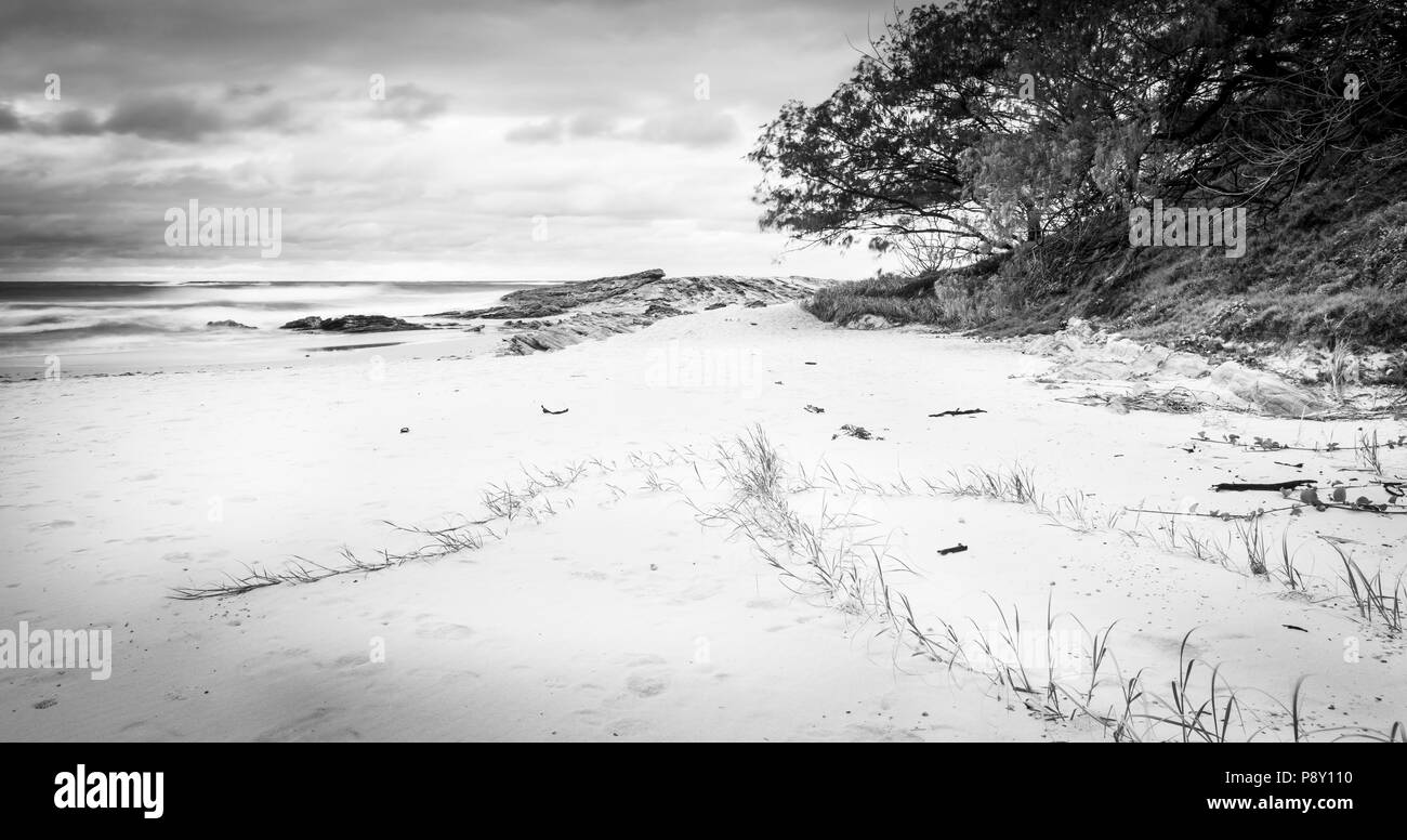 Stradbroke Island beach sunrise on Deadmans Beach in Queensland, Australia in black and white Stock Photo