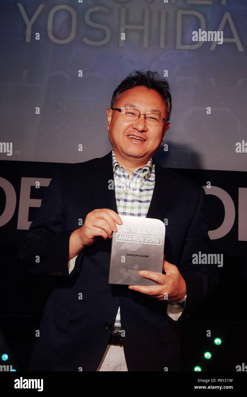 Brighton - July 11 2018: The President of Sony Interactive Entertainment, Shuhei Yoshida, accepts his award for Develop Legend at Brightons Develop Co Stock Photo