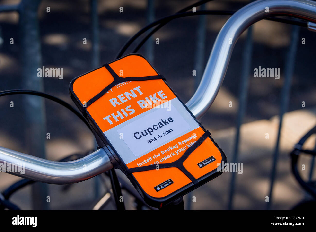 The handlebar of a new ride share bicycle company, Donkey Republic on a Paris street Stock Photo
