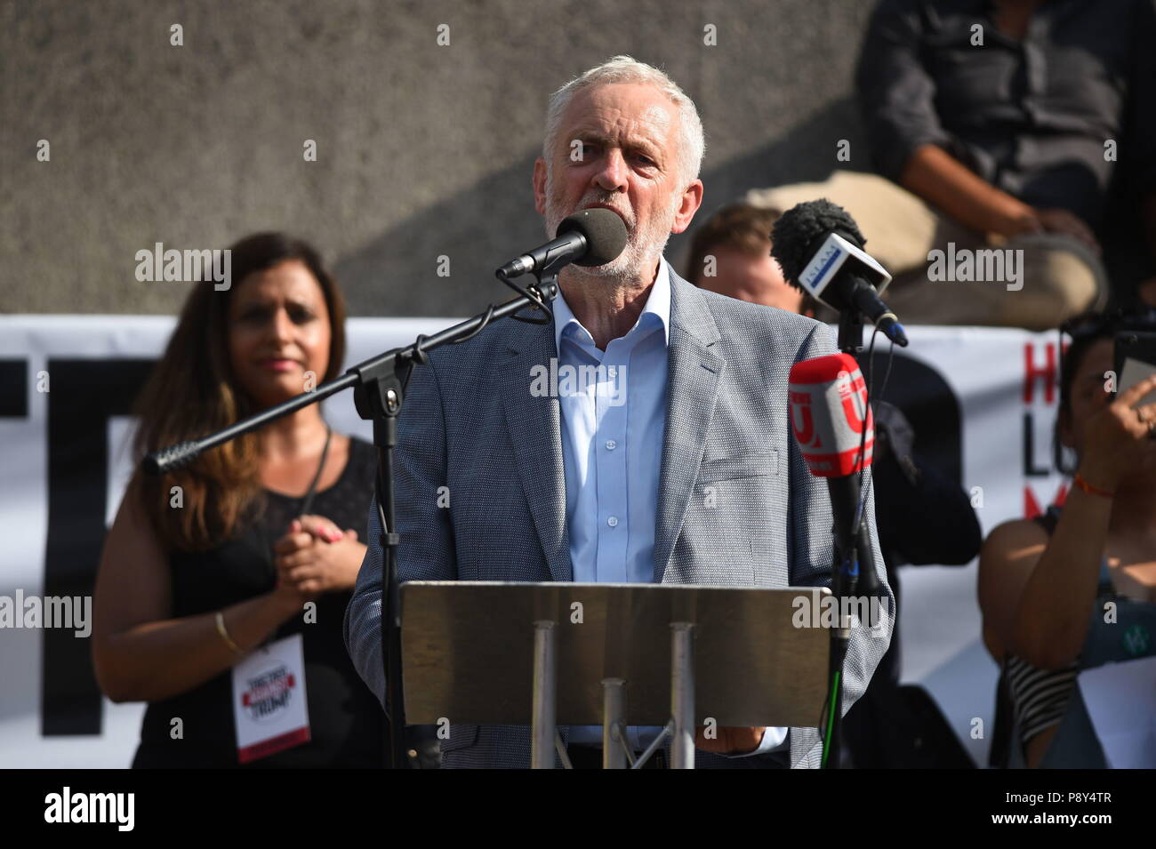 Labour leader Jeremy Corbyn speaks to demonstrators marching through London, during protests against the visit of US President Donald Trump to the UK. Stock Photo