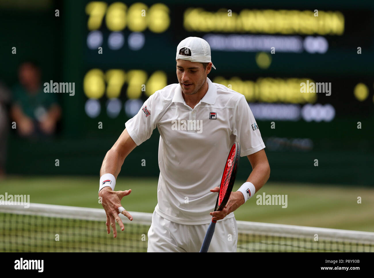 John Isner reacts on day eleven of the Wimbledon Championships at the All England Lawn Tennis and Croquet Club, Wimbledon. Stock Photo