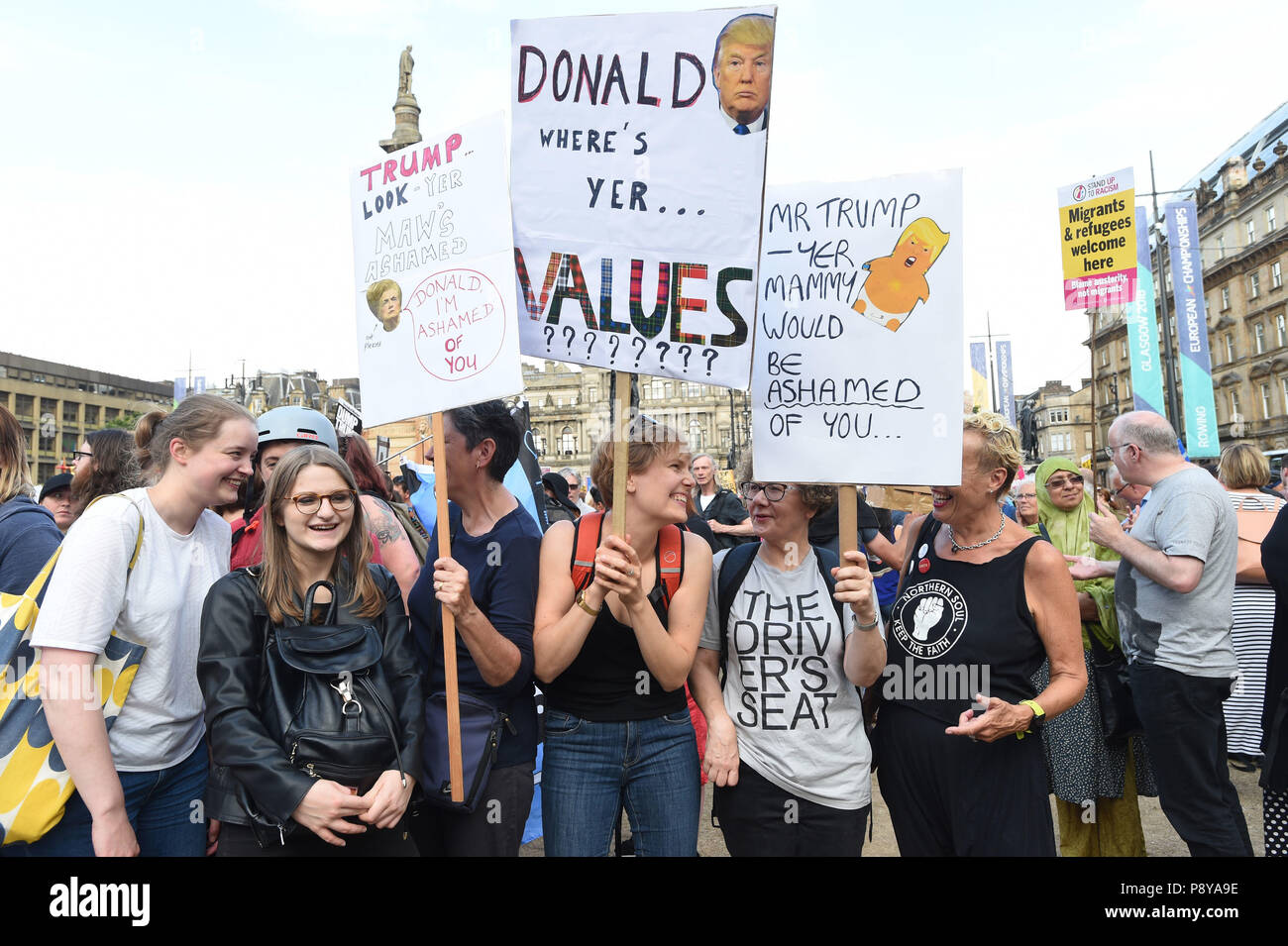 Demonstrators in George Square, Glasgow, for the Scotland United Against Trump protest against the visit of US President Donald Trump to the UK. Stock Photo