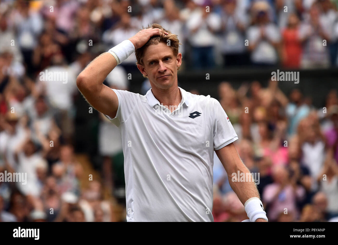 Kevin Anderson following his 7-6 (8/6) 6-7 (5/7) 6-7 (9/11) 6-4 26-24 victory in the longest semi-final in the tournament’s history on day eleven of the Wimbledon Championships at the All England Lawn Tennis and Croquet Club, Wimbledon. Stock Photo