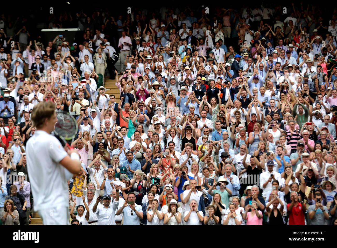 South African eighth seed Kevin Anderson celebrates having reached his first Wimbledon final, beating American ninth seed John Isner 7-6 (8/6) 6-7 (5/7) 6-7 (9/11) 6-4 26-24 in the longest semi-final in the tournament's history on day eleven of the Wimbledon Championships at the All England Lawn Tennis and Croquet Club, Wimbledon. Stock Photo