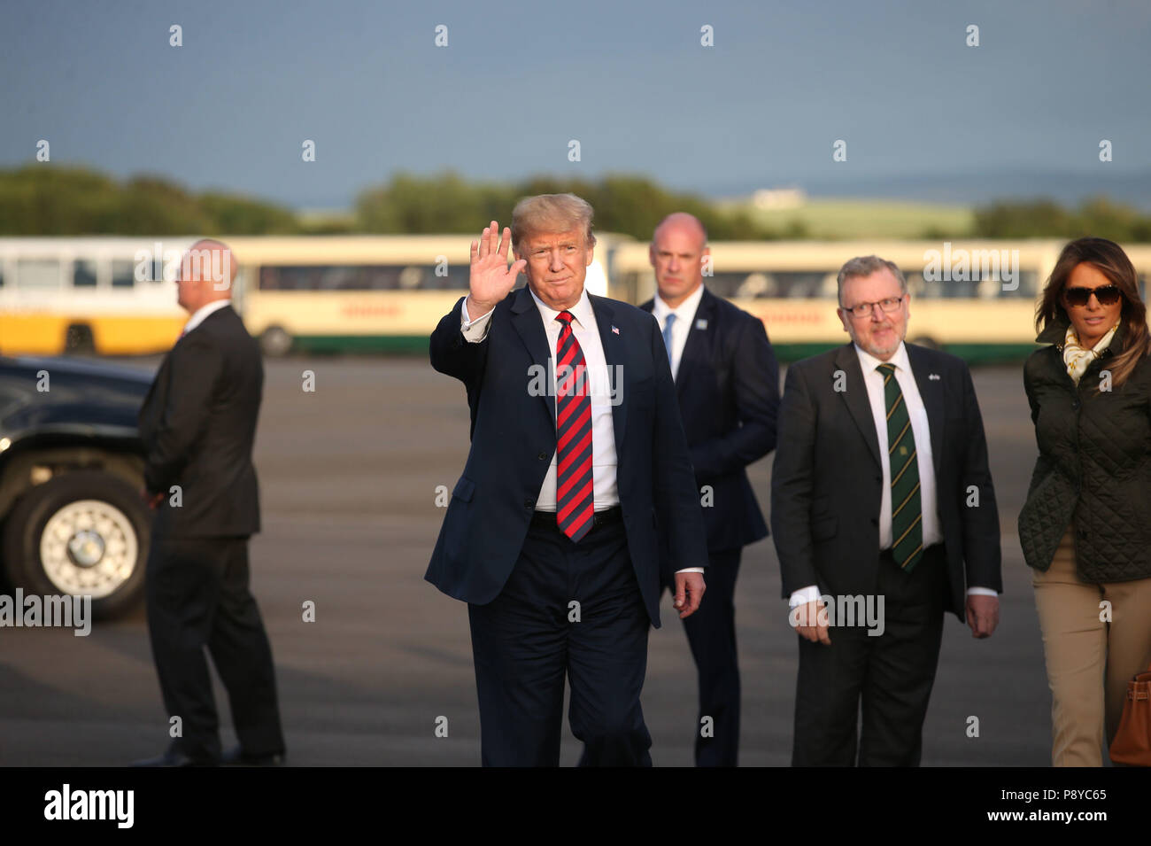 US President Donald Trump and his wife, Melania are welcomed by Scottish Secretary David Mundell (second right), as they arrive on Air Force One at Prestwick airport in Ayrshire, en route for Turnberry, where they are expected to stay over the weekend. Stock Photo