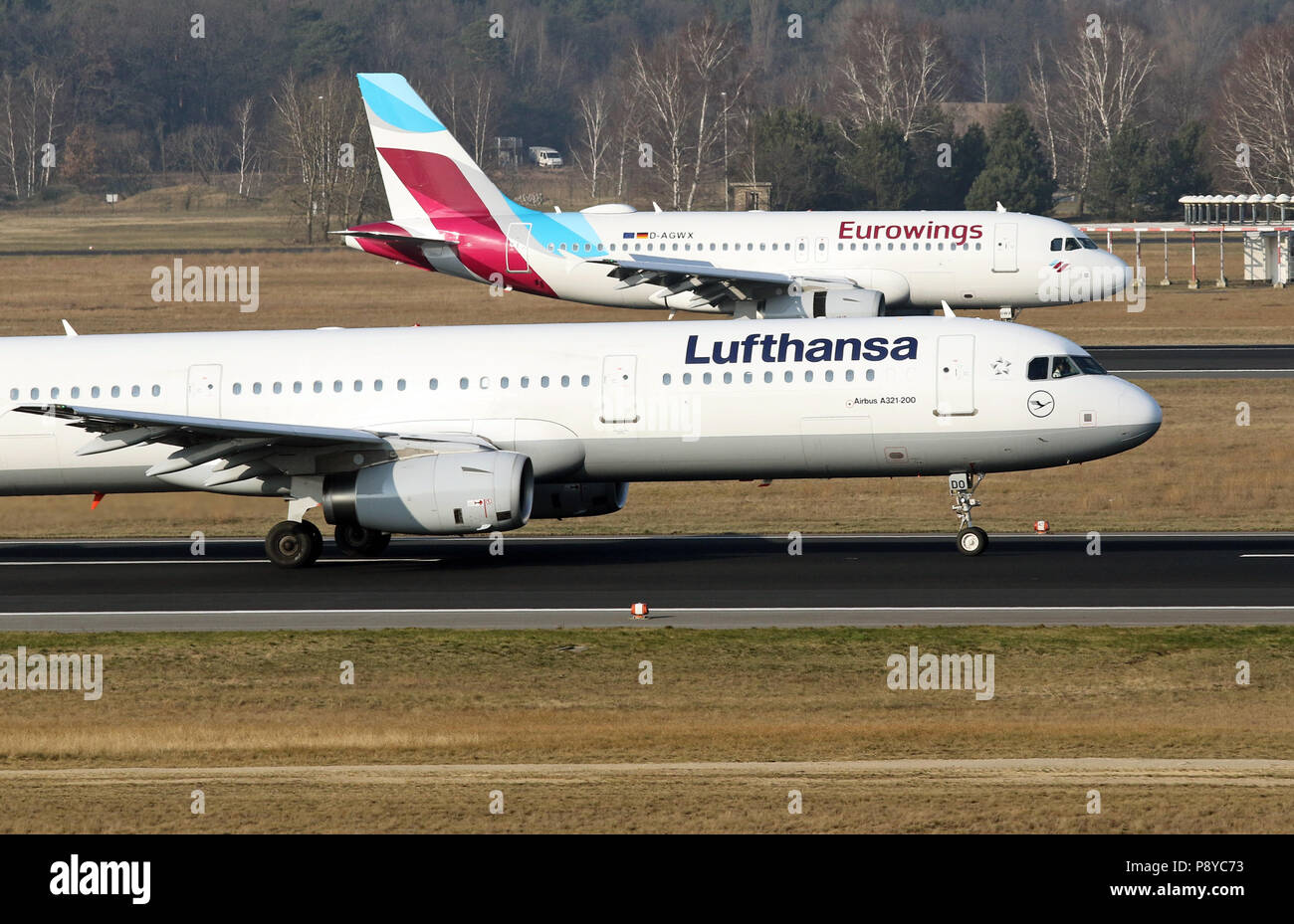 Berlin, Germany, Airbus A321 of the airline Lufthansa and A 319 of the Eurowings on runway of the airport Berlin-Tegel Stock Photo