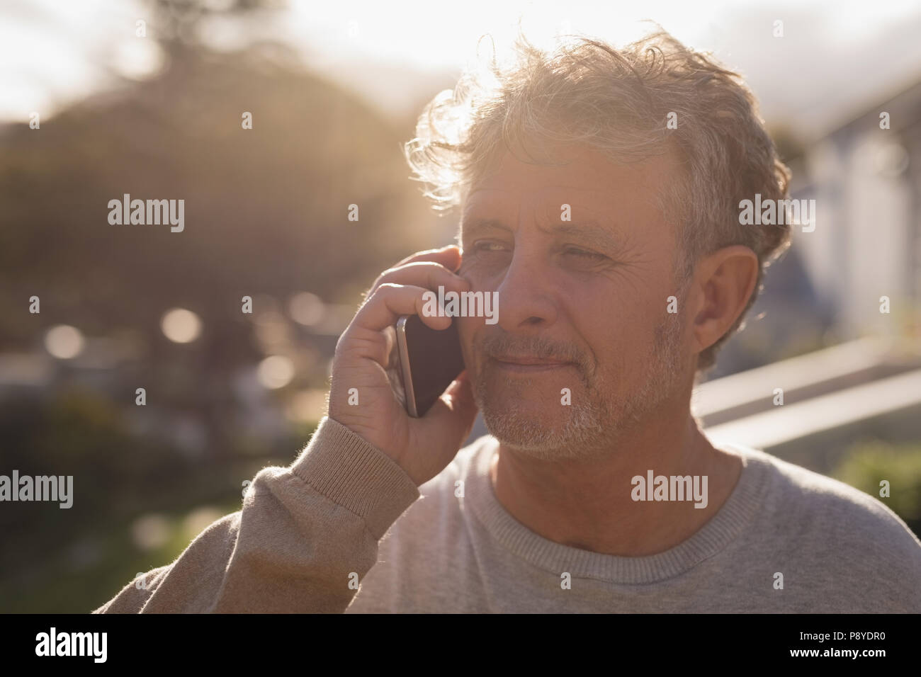 Senior man talking on mobile phone Stock Photo