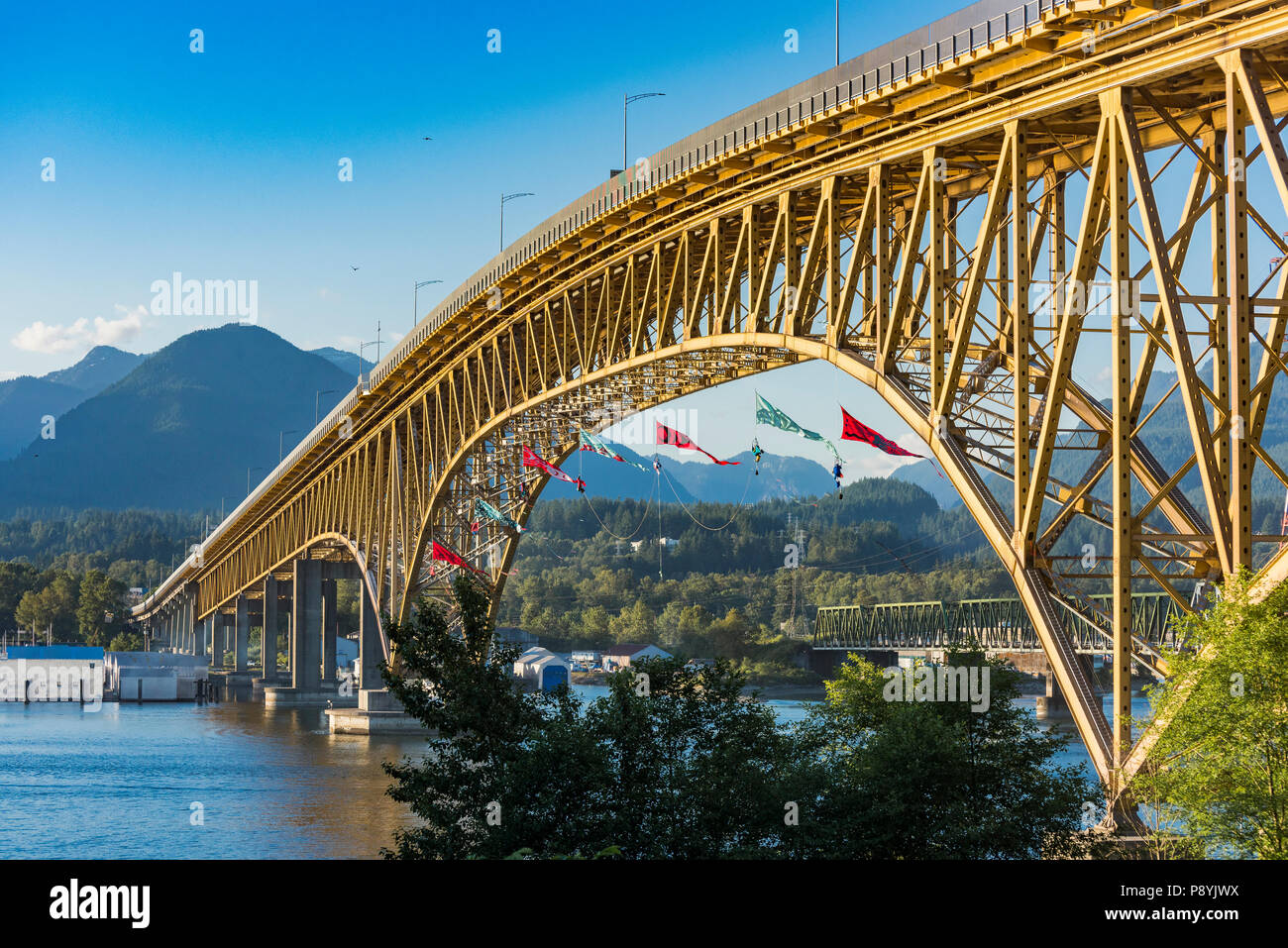 Greenpeace activists hang from Ironworkers Memorial Bridge to prevent oill tankers from