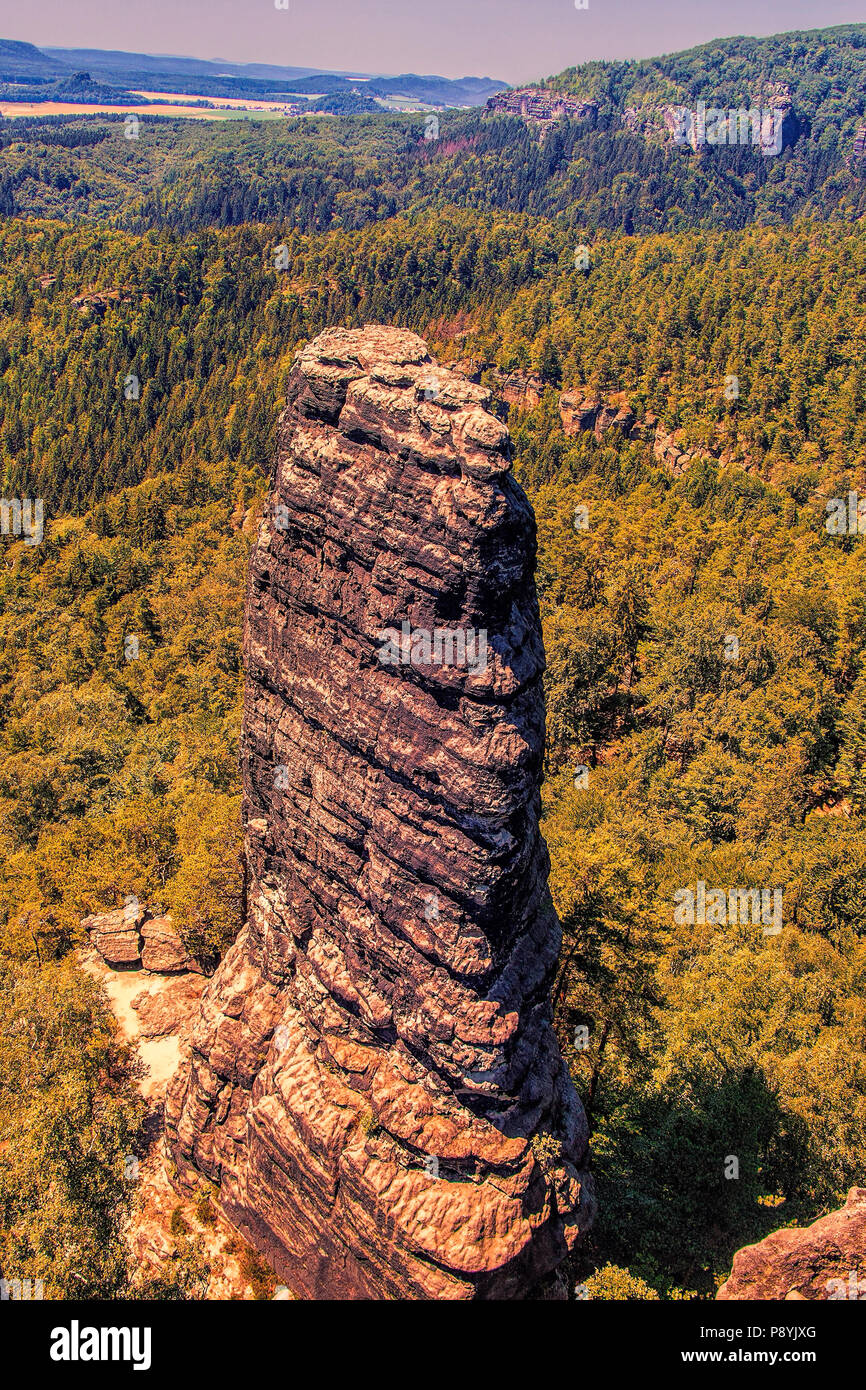 Tall rock, stone peak in Czech Switzerland National Park, aerial landscape view. Stock Photo