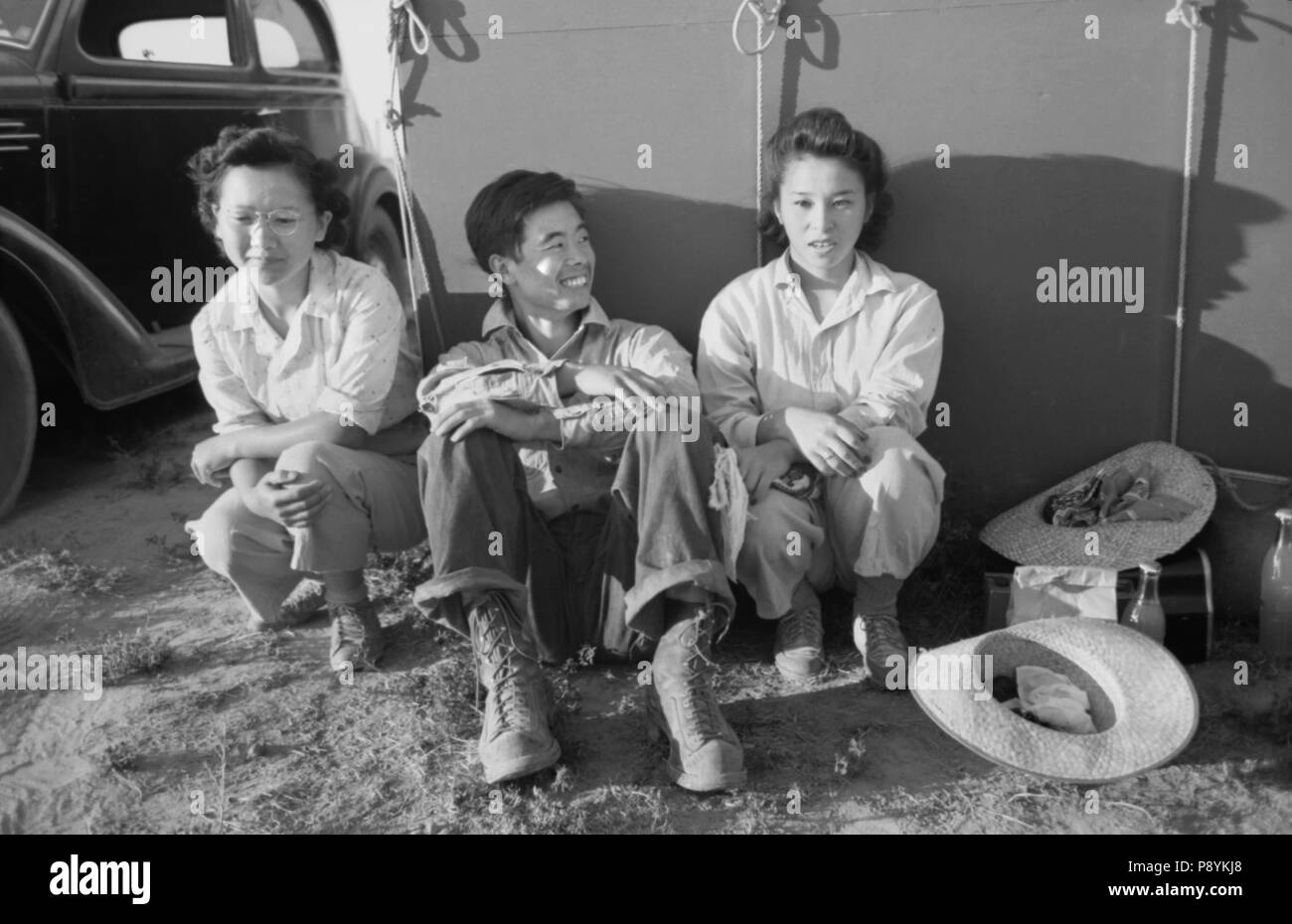 Japanese-American Farm Worker's Family outside near their Tent, Farm Security Administration (FSA) Mobile Camp, Nyssa, Oregon, USA, Russell Lee, Farm Security Administration, July 1942 Stock Photo