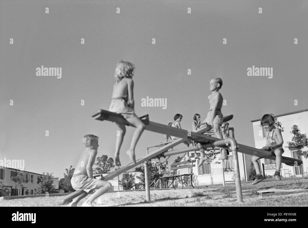 Children on Seesaw at Playground, Greenbelt, Maryland, USA, Marion Post Wolcott, Farm Security Administration, September 1938 Stock Photo