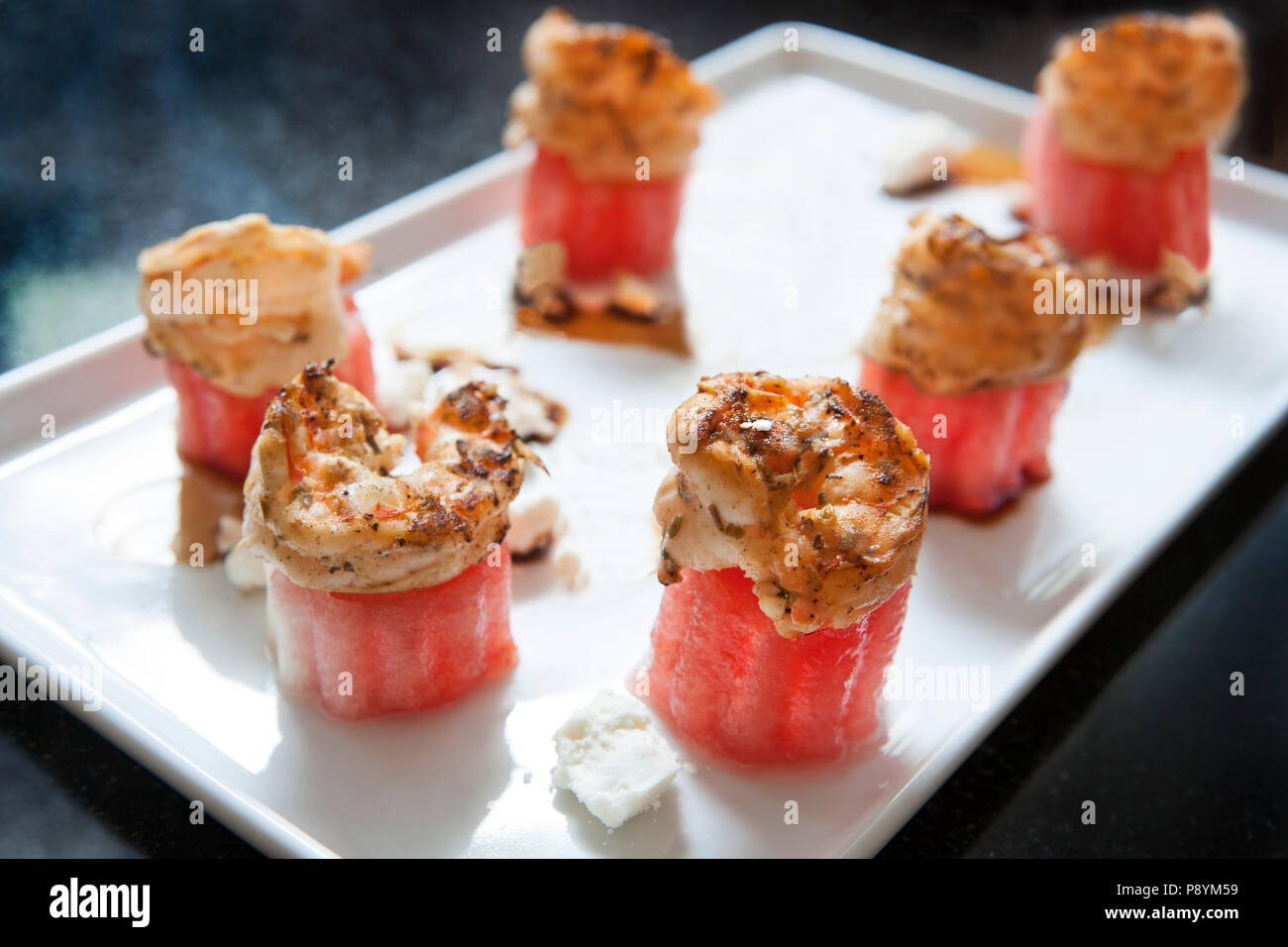 Watermelon Shrimp on White Plate Stock Photo