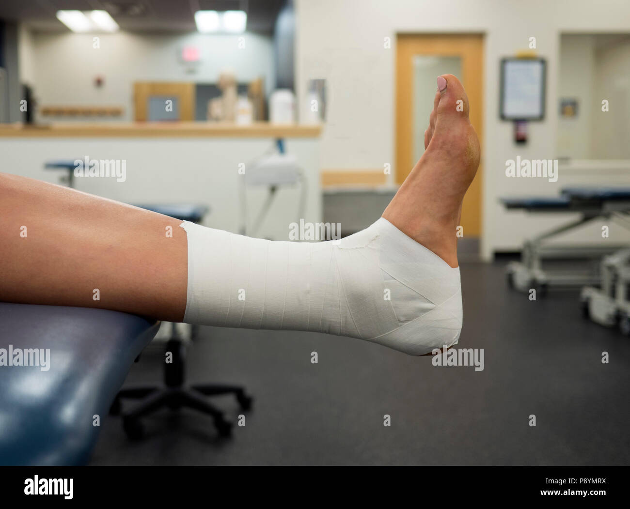 Ankle Tape Job on a varsity athlete in the clinic Stock Photo Alamy