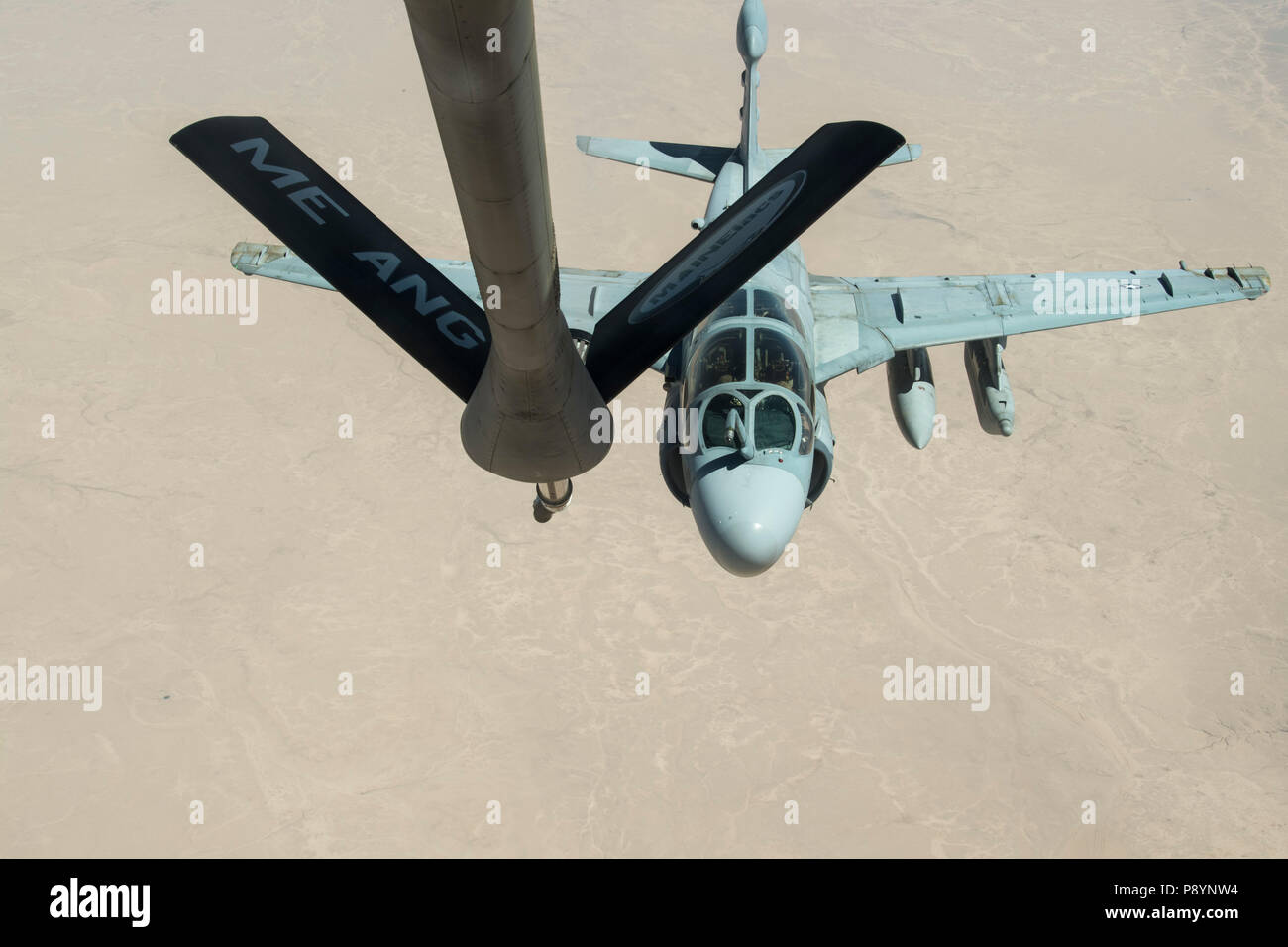 A U.S. Marine Corps EA-6B Prowler, assigned to Marine Tactical Electronic Warfare Squadron 2, receives in-flight fuel from a KC-135 Stratotanker assigned to the 28th Expeditionary Air Refueling Squadron during an aerial refueling mission in support of Operation Inherent Resolve over Iraq, June 28, 2018. The primary mission of the EA-6B Prowler is suppression of enemy air defenses in support of strike aircraft and ground troops by interrupting enemy electronic activity and obtaining tactical electronic intelligence within the combat area. In conjunction with partner forces, Combined Joint Task  Stock Photo