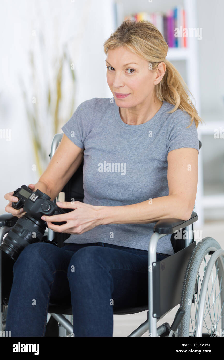 disabled female photographer Stock Photo