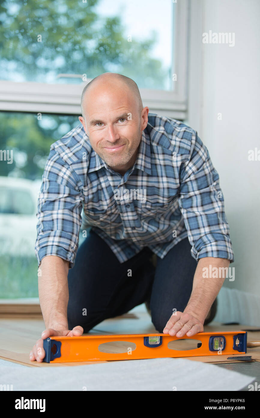 leveling the laminated flooring Stock Photo