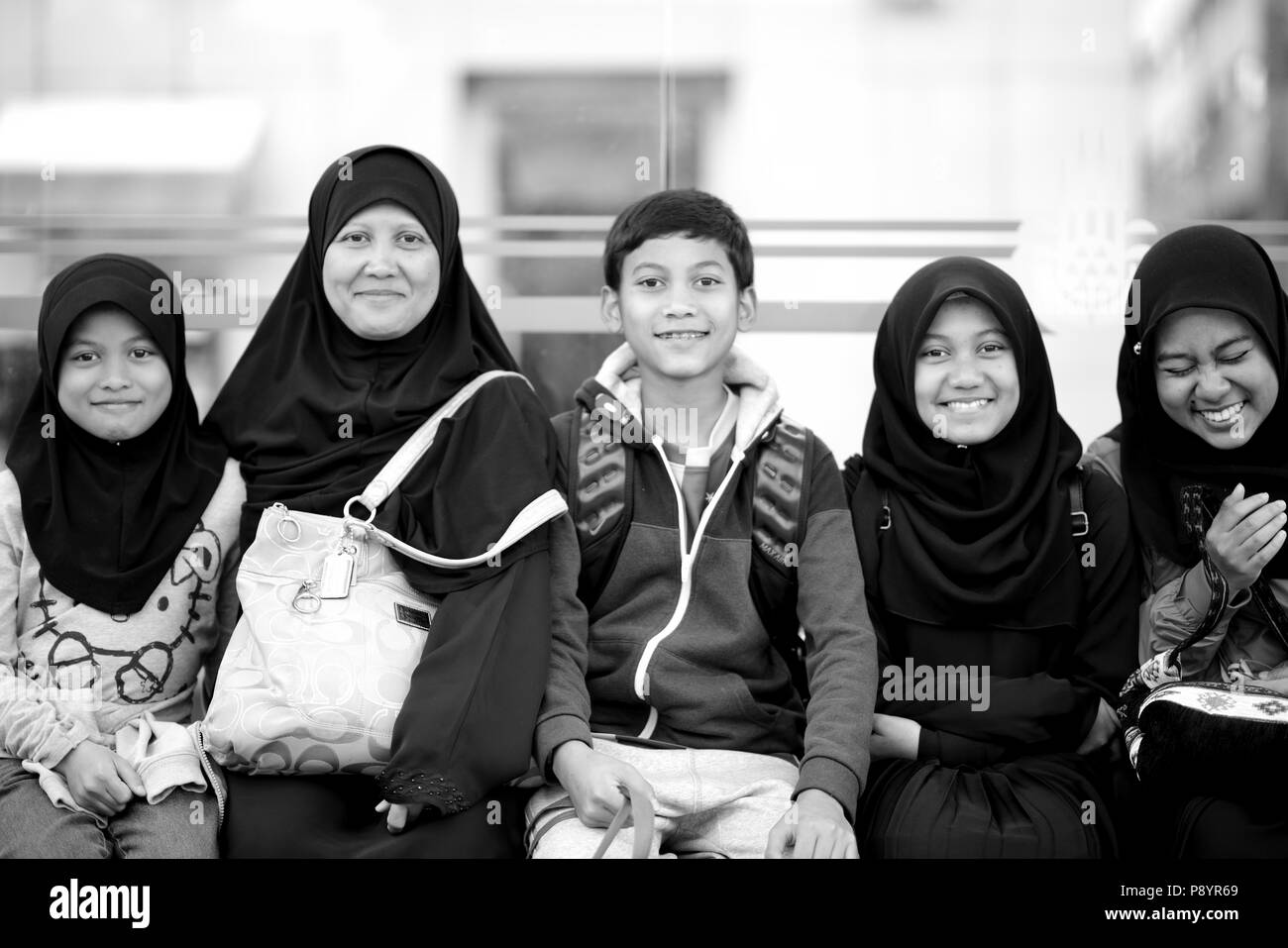 happy Muslim family smiling and having fun in Islamic dress, Islamic dress code Stock Photo