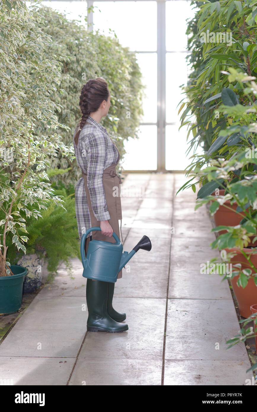 Watering can and wellington boots hi-res stock photography and images ...